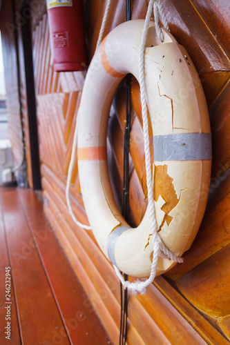 Old, Broken and Expired Personal life support flotation safety device (life buoy) for swimmers, passengers or marine personnel working on boat or area exposed to water. Drowning Protection Equipment.