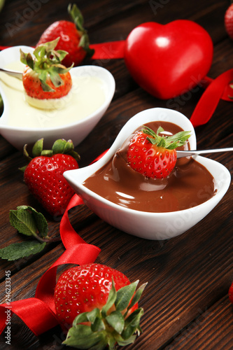 Valentine Chocolate fondue melted with fresh strawberries and dark and white chocolate. Tublips and sugar hearts.