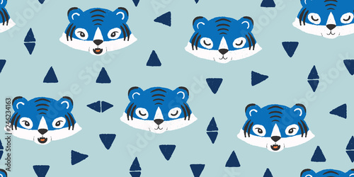 vector seamless repeat pattern with cute tiger faces and triangles on a blue background
