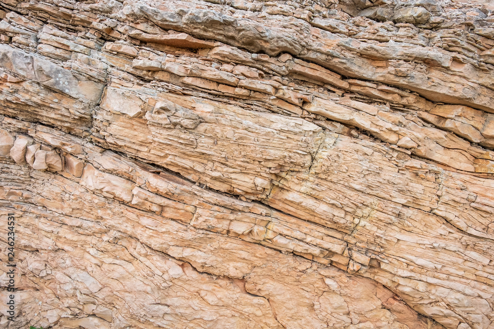 The close-up relief of the rocks texture with layers. The close-up relief of the rocks texture with layers.