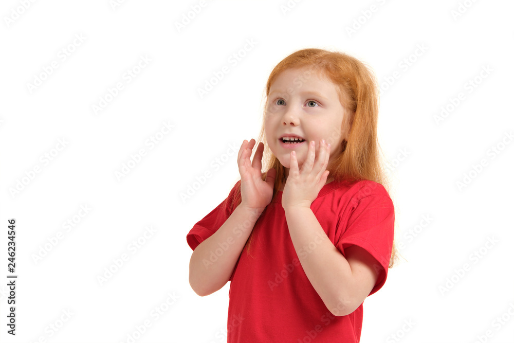 Pleasant cute upbeat little girl holding her hands near face and smiling while expressing joy. Pleasant cute upbeat little girl holding her hands near face and smiling while expressing joy.