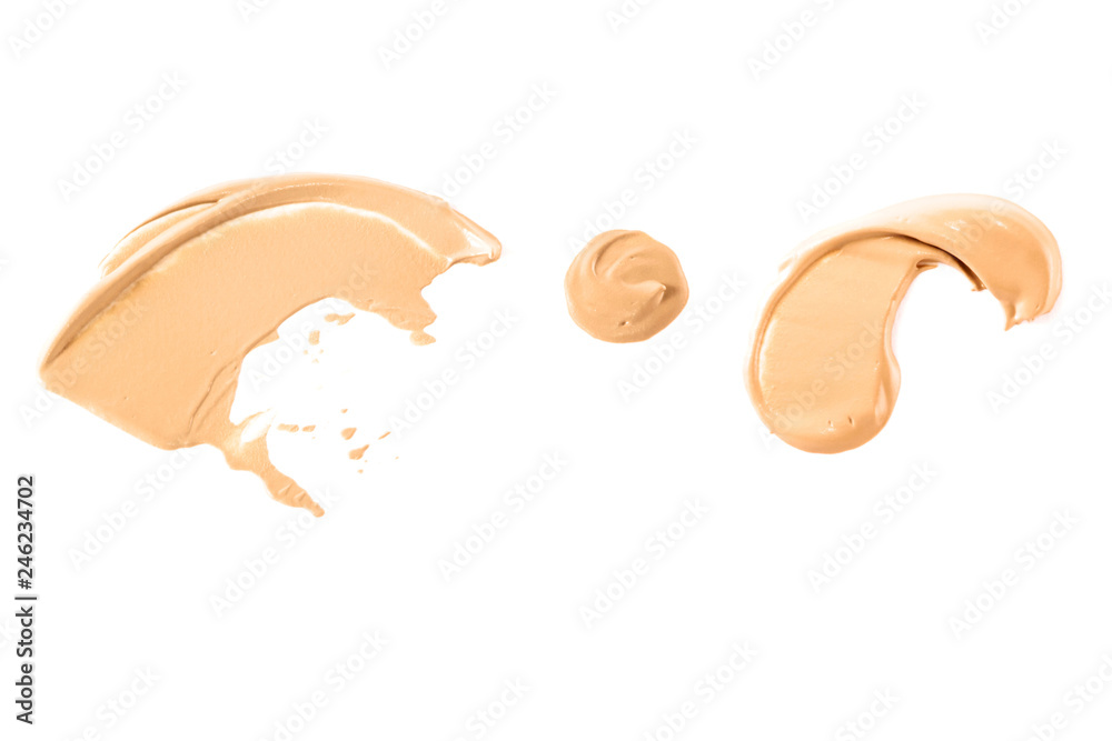 Group of bright beige smears of foundation isolated on white background. Group of bright beige smears of foundation isolated on white background.