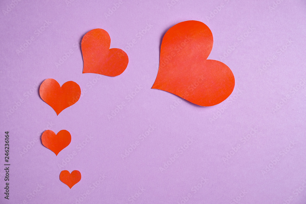 Many hearts on a purple background with extra space for text.
