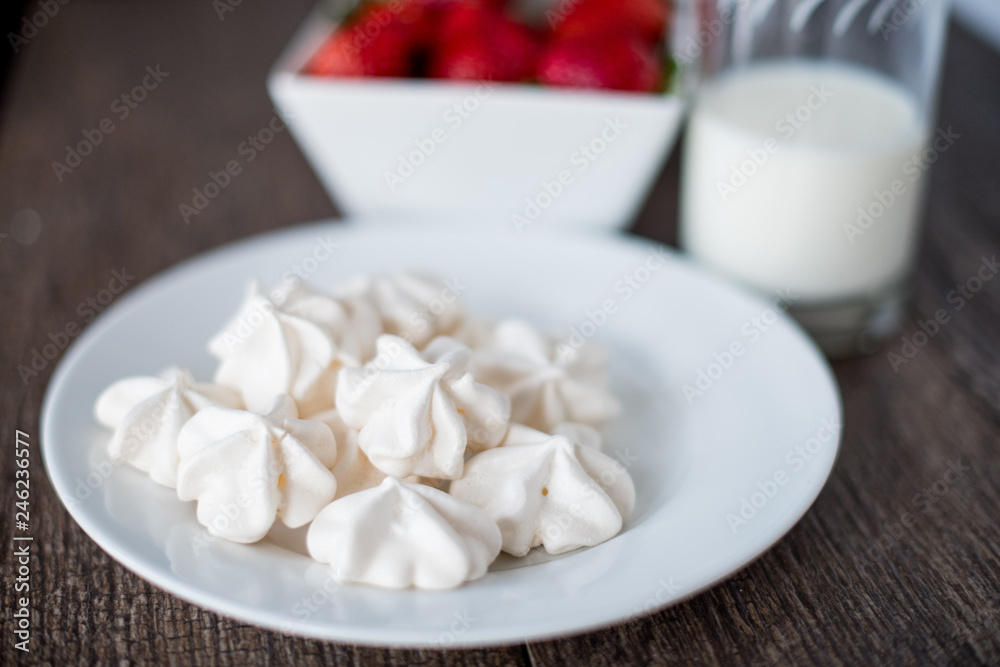 Meringue cookies with berries and milk Meringue cookies with berries and milk