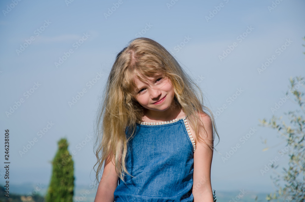 girl with long blond hair sitting girl with long blond hair sitting