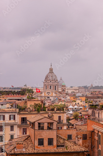 View of roofs and churches domes in Rome from Pincio hill, Italy