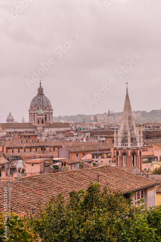 View of roofs and churches domes in Rome from Pincio hill, Italy