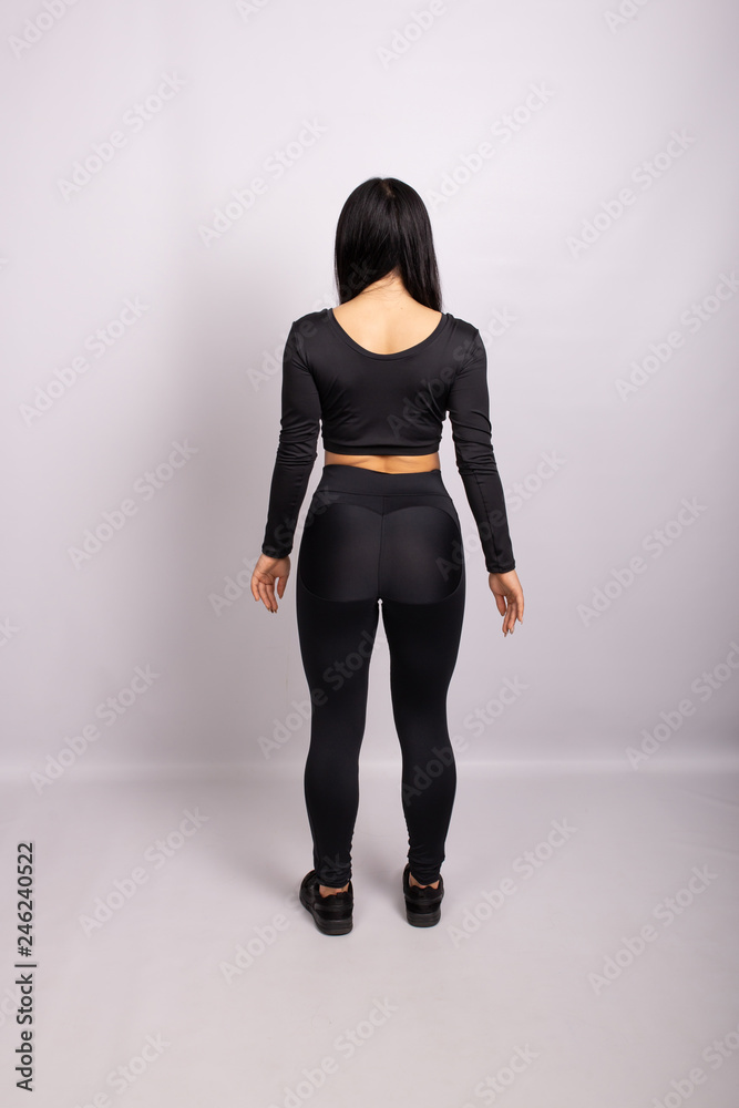 Sportive woman wearing black leggings and top Sportive woman wearing black leggings and top