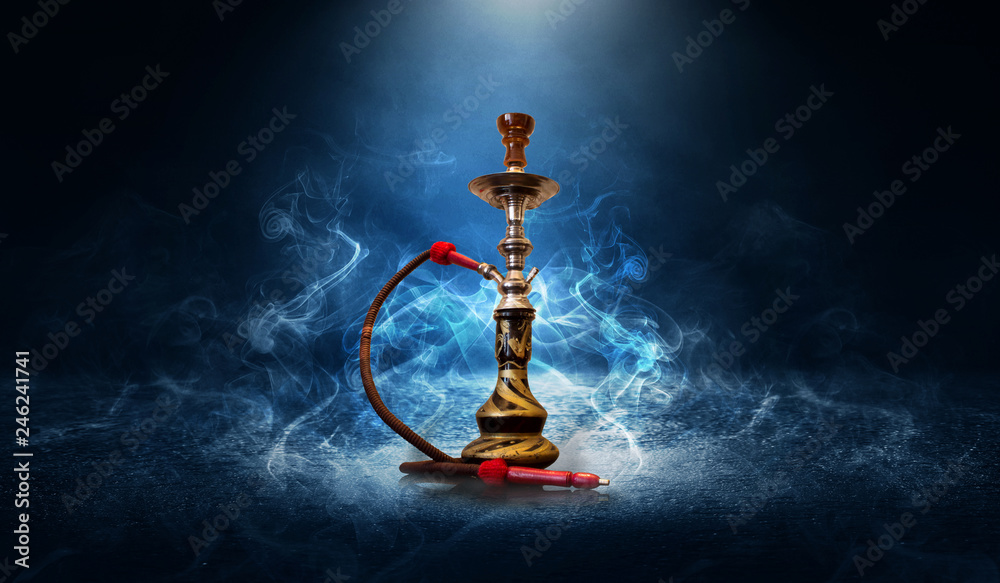 Hookah smoking on a blue futuristic background of an empty room, neon light, smoke Hookah smoking on a blue futuristic background of an empty room, neon light, smoke