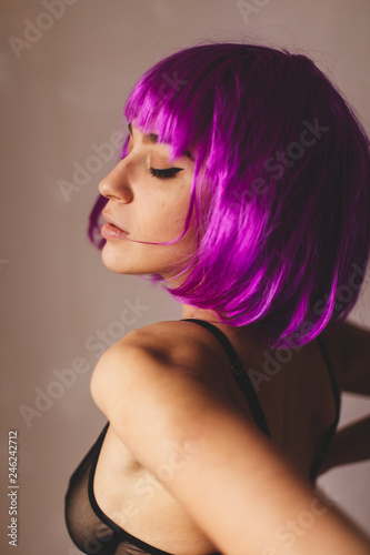 Beautiful back of naked woman wear pink wig. Portrait of nude girl. Sexy young lady in black underwear. Hot woman wear lingerie.