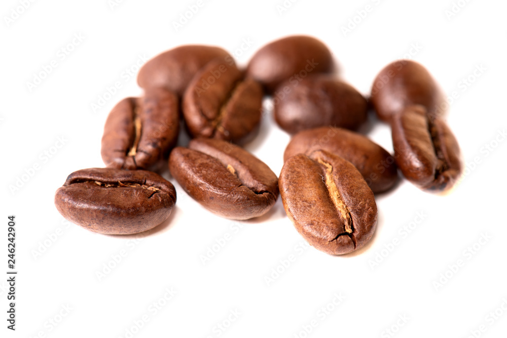 Macro of coffee beans on white background. Selective focus Macro of coffee beans on white background. Selective focus