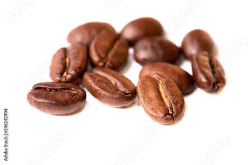 Macro of coffee beans on white background. Selective focus