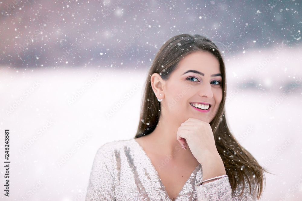 Besutiful woman portrait in the snow