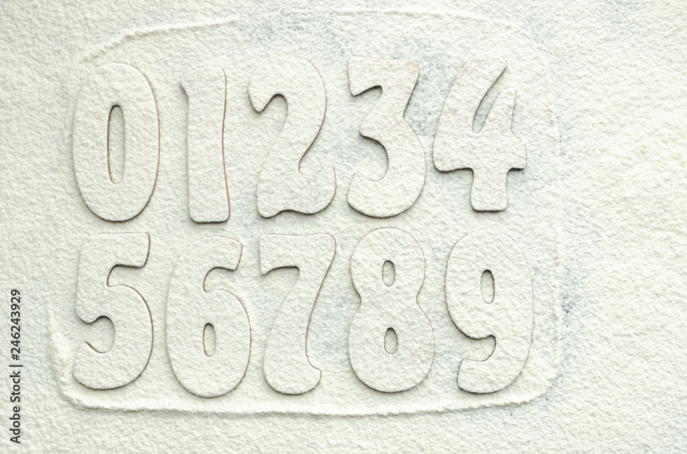 Numbers on white flour. Numbers on white background. Numbers on white flour. Numbers on white background.