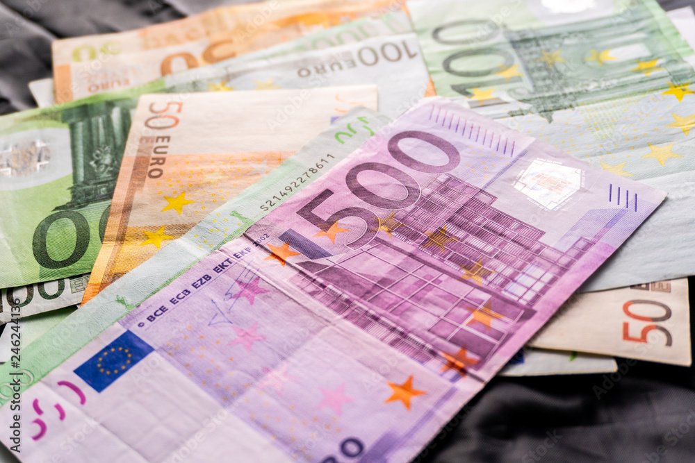 Euro banknotes in salary envelope. Open envelope with money banknotes on table. White envelope with Euro bills. Closeup on Envelope full of euro cash. Euro money currency. International monetary Euro banknotes in salary envelope. Open envelope with money banknotes on table. White envelope with Euro bills. Closeup on Envelope full of euro cash. Euro money currency. International monetary