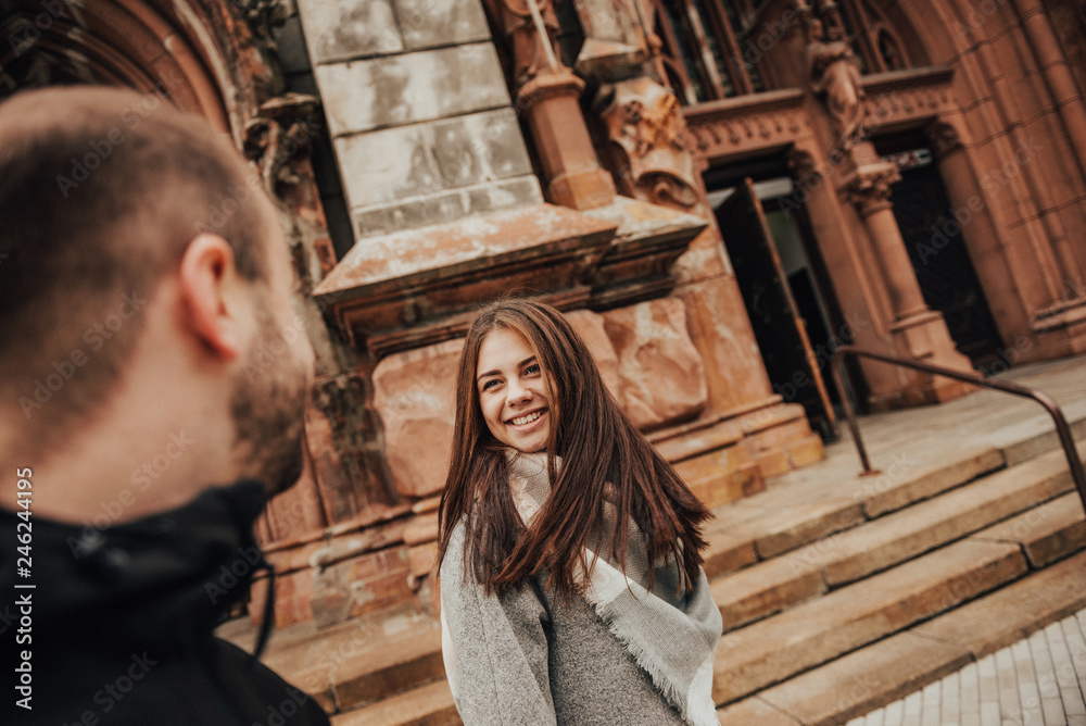 Fototapeta premium Happy lovely girl looks at her boyfriend