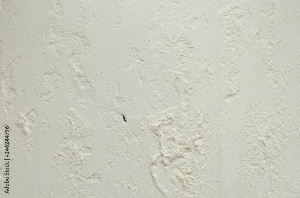 Texture of white flour on a dark wooden background. Texture of white flour on a dark wooden background.