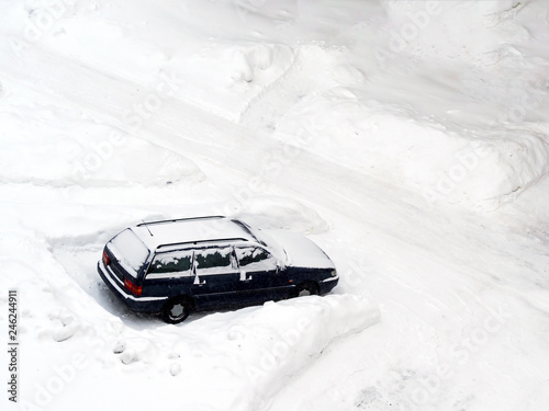 Ground parking cars after snowfall photo