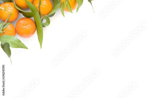 Fresh raw organic Tangerines clementine with green leaves isolated on a white background with space for your text.Top view