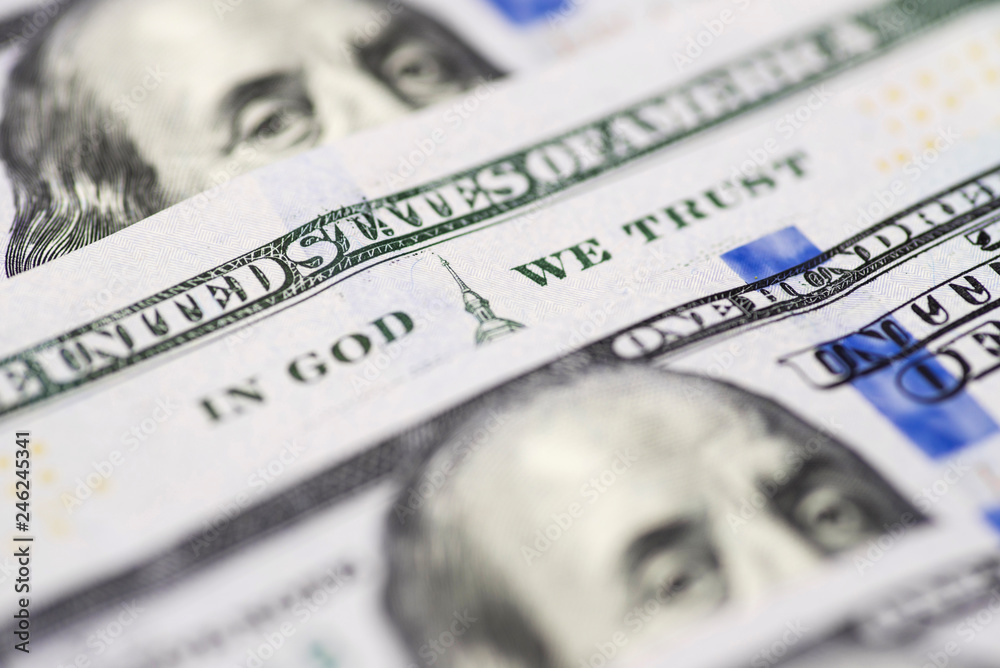 In god we trust sentence on 100 dollar banknote close up view. In God We Trust from the 100 dollar bill In god we trust sentence on 100 dollar banknote close up view. In God We Trust from the 100 dollar bill