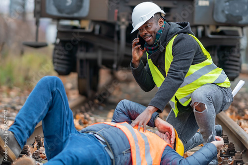 Fotografía Railroad engineer injured in an accident at work on the railway tracks