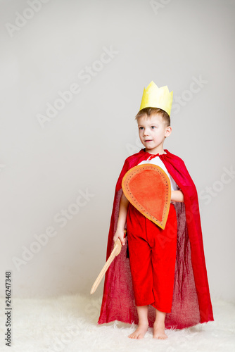 child in knight costume with crown