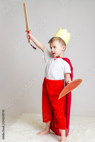 child in knight costume with crown