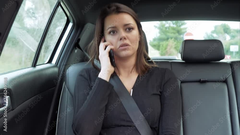 Unhappy woman in taxi talking on the phone 4K Unhappy woman in taxi talking on the phone 4K