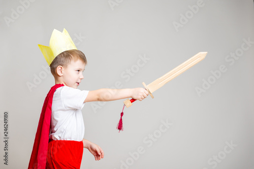 child in knight costume with crown