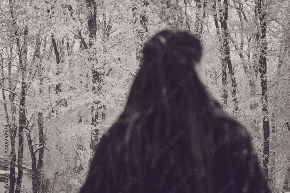 stylish portrait of an attractive woman with long pigtails, dressed in an eco-coat and scarf, walked in a winter-frozen city, selective focus stylish portrait of an attractive woman with long pigtails, dressed in an eco-coat and scarf, walked in a winter-frozen city, selective focus