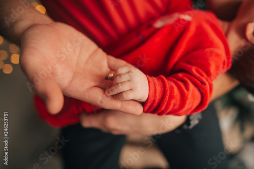 Baby hand in a parent hand