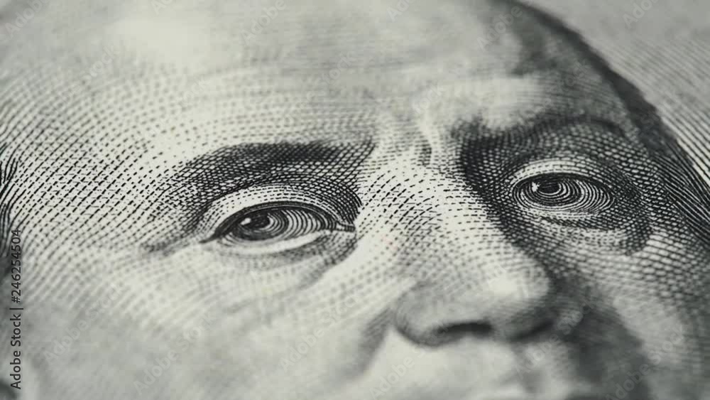 Benjamin Franklin on US 100 dollar bill macro slow rotating. Low angle shot. Stock video footage