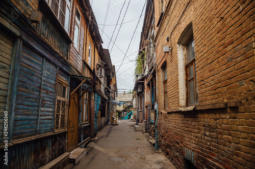 Narrow street in old poverty part of Astrakhan city in Russia