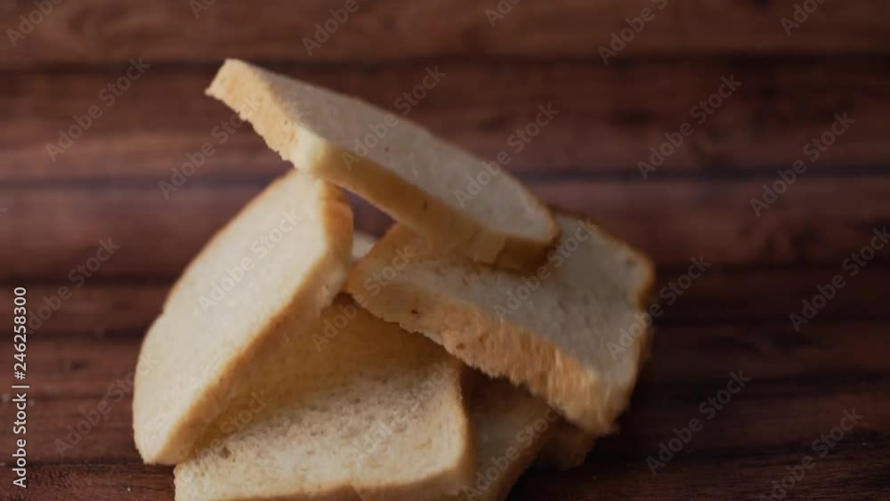 Slices of bread on wooden background Slices of bread on wooden background