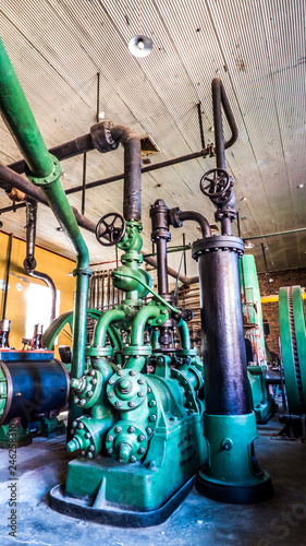 perspective view of old machine for freezer pipes green valves