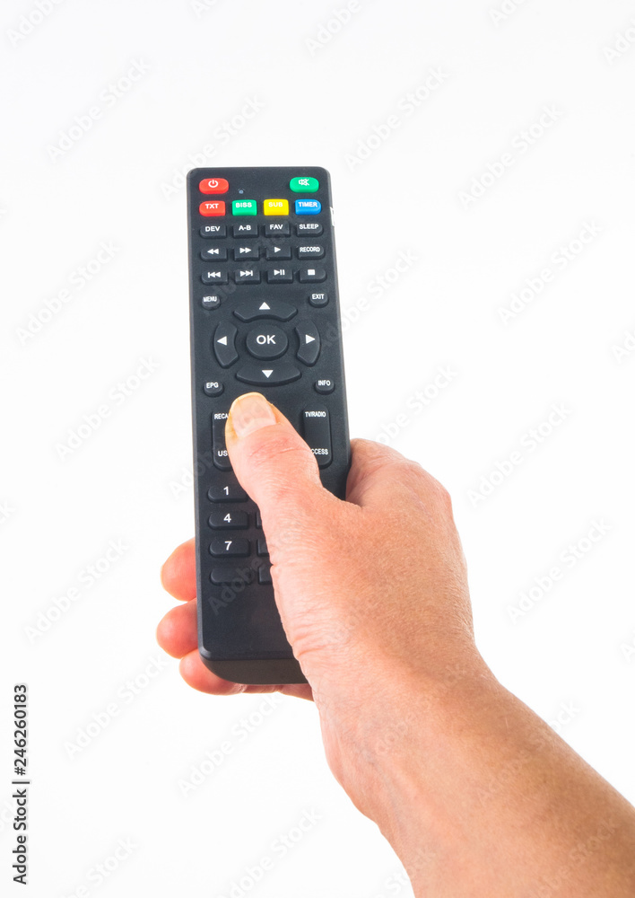 hand holding a remote control on white background, close-up hand holding a remote control on white background, close-up
