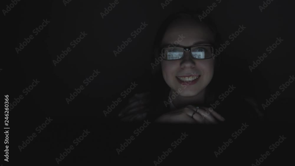 The girl receptionist at work. Attractive young businesswoman working at night via computer at office with, closeup of hipster student girl browsing the internet, looking at monitor of modern computer
