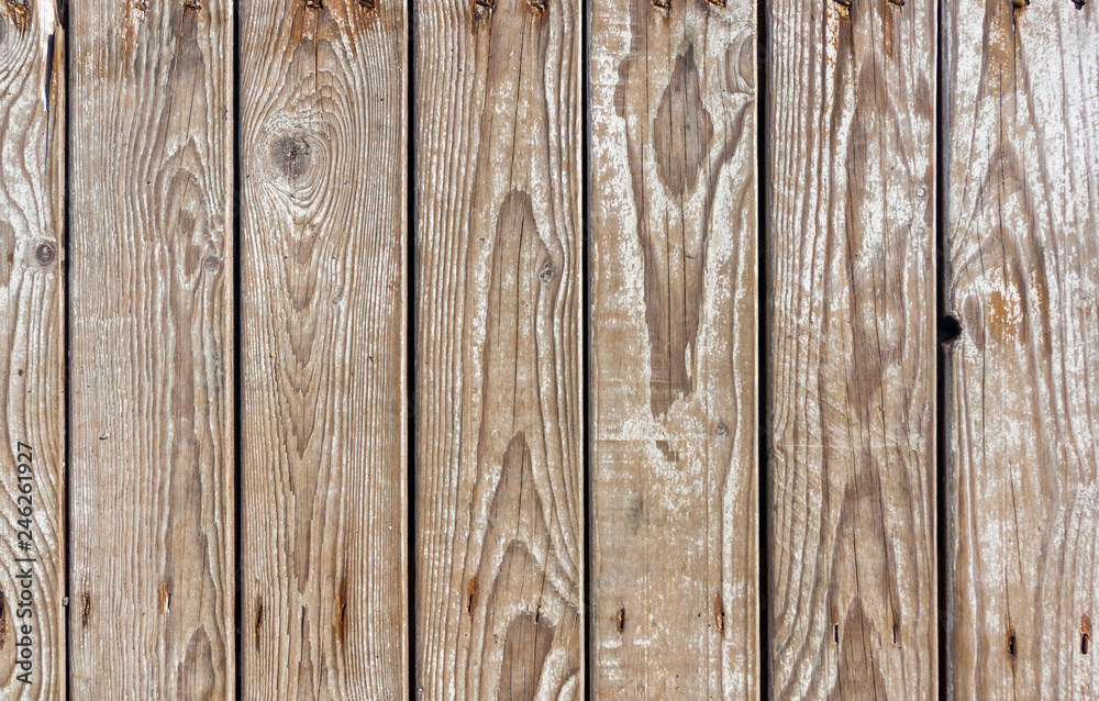 Naklejka premium texture of the painted shabby wooden flooring made of boards, grunge background