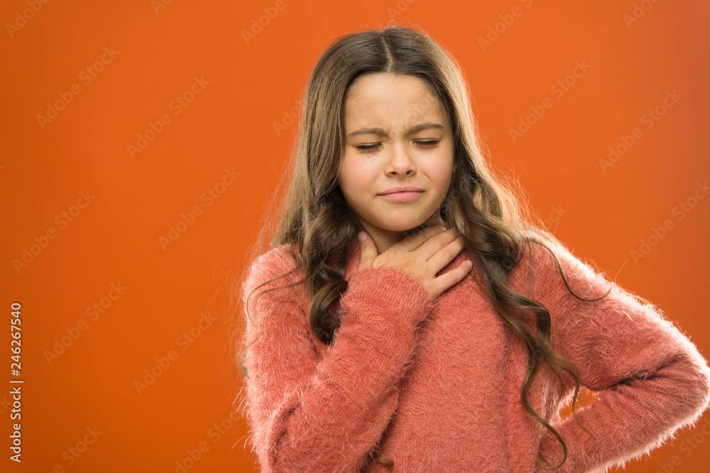 Lost her voice. Sore throat quick remedies. Kid feel pain in throat. Suffer from pain neck. Girl painful face orange background. Health care and medicine. Sore throat remedies. Throat pain treatment Lost her voice. Sore throat quick remedies. Kid feel pain in throat. Suffer from pain neck. Girl painful face orange background. Health care and medicine. Sore throat remedies. Throat pain treatment