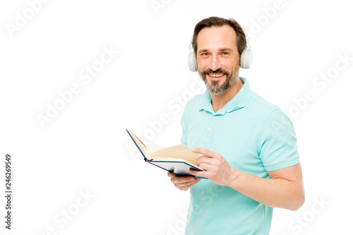 Online education. Man mature bearded guy listening online course. Get more information. Audio book. Reading and listening. Modern education concept. Benefits of online education. Access to knowledge