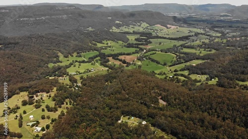 Aerial video of beautiful farmlands, lakes, and valleys of the Southern Highlands of NSW, Australia. photo