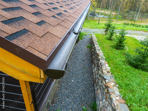Bild auf Leinwand Holder gutter drainage system on the roof