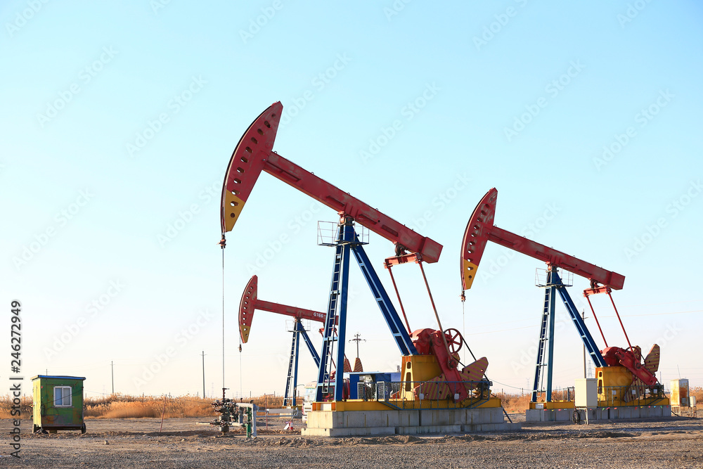 Pumping units at work in the blue sky background