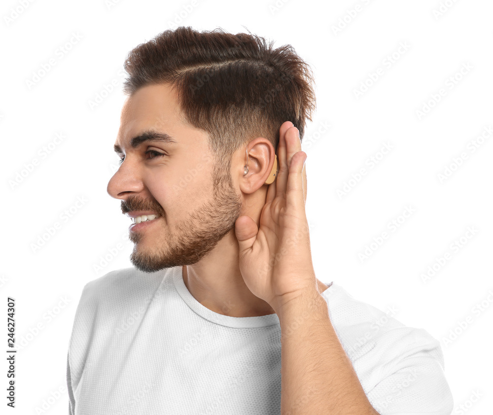 Young man with hearing aid on white background Young man with hearing aid on white background