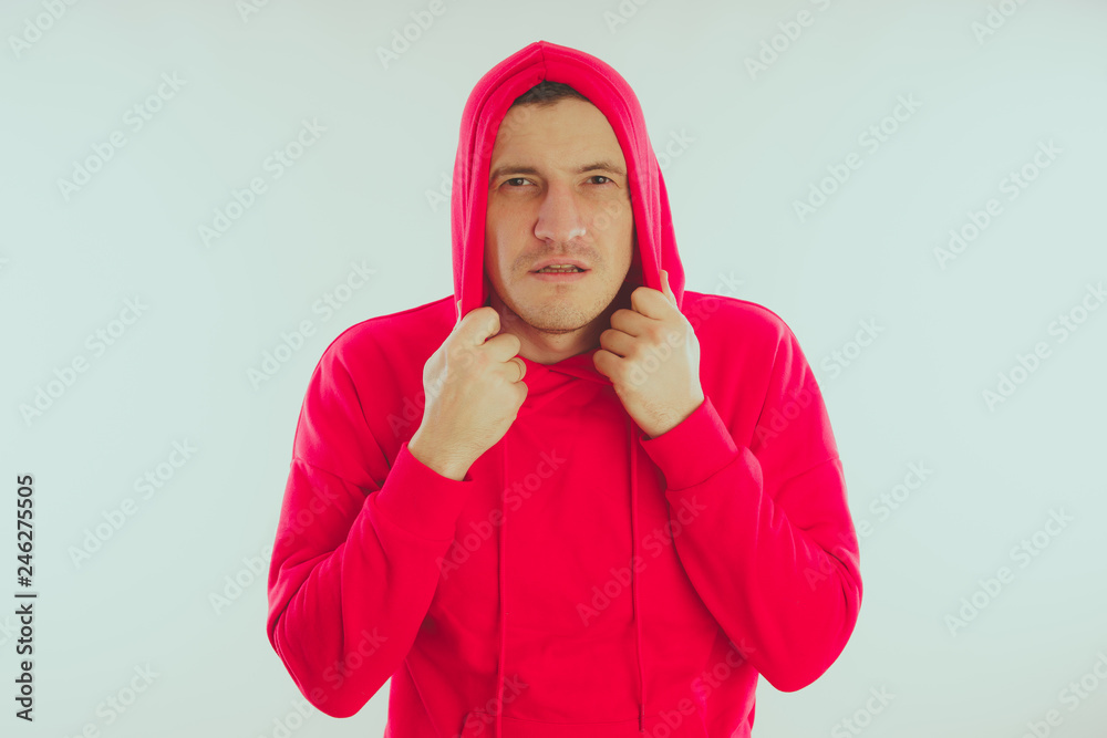 Crazy and charismatic guy posing. A man in a red tracksuit. Man isolated on white background, space for text Crazy and charismatic guy posing. A man in a red tracksuit. Man isolated on white background, space for text