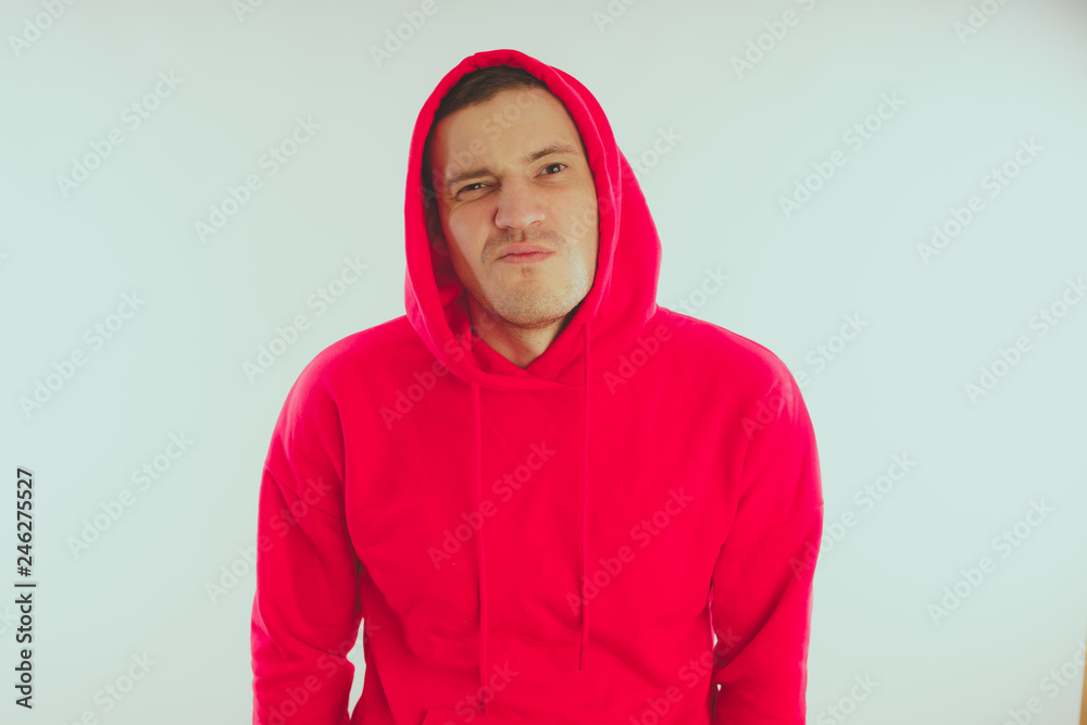 Crazy and charismatic guy posing. A man in a red tracksuit. Man isolated on white background, space for text Crazy and charismatic guy posing. A man in a red tracksuit. Man isolated on white background, space for text