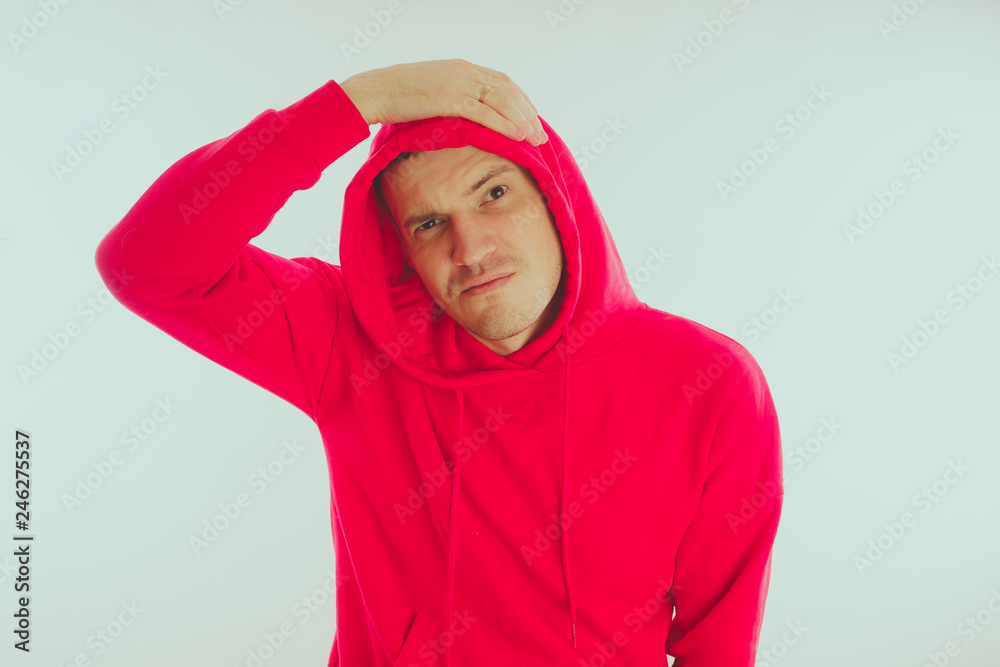 Crazy and charismatic guy posing. A man in a red tracksuit. Man isolated on white background, space for text Crazy and charismatic guy posing. A man in a red tracksuit. Man isolated on white background, space for text