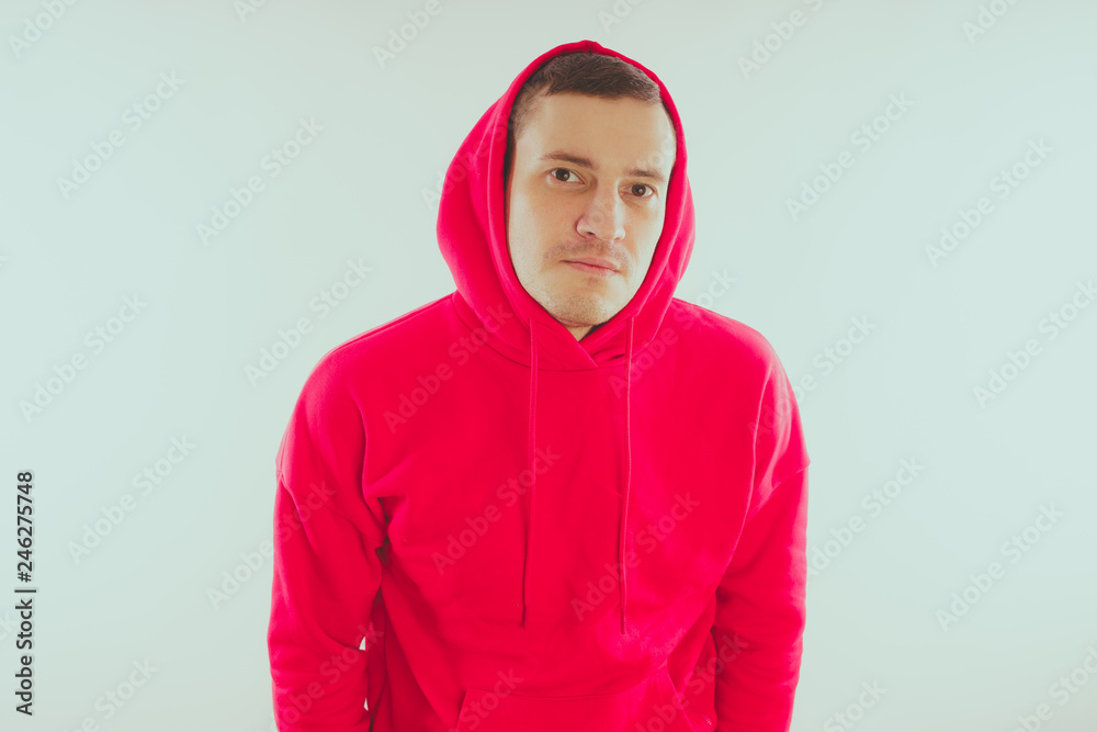 Crazy and charismatic guy posing. A man in a red tracksuit. Man isolated on white background, space for text Crazy and charismatic guy posing. A man in a red tracksuit. Man isolated on white background, space for text