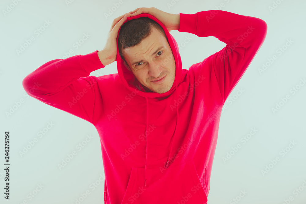 Crazy and charismatic guy posing. A man in a red tracksuit. Man isolated on white background, space for text Crazy and charismatic guy posing. A man in a red tracksuit. Man isolated on white background, space for text