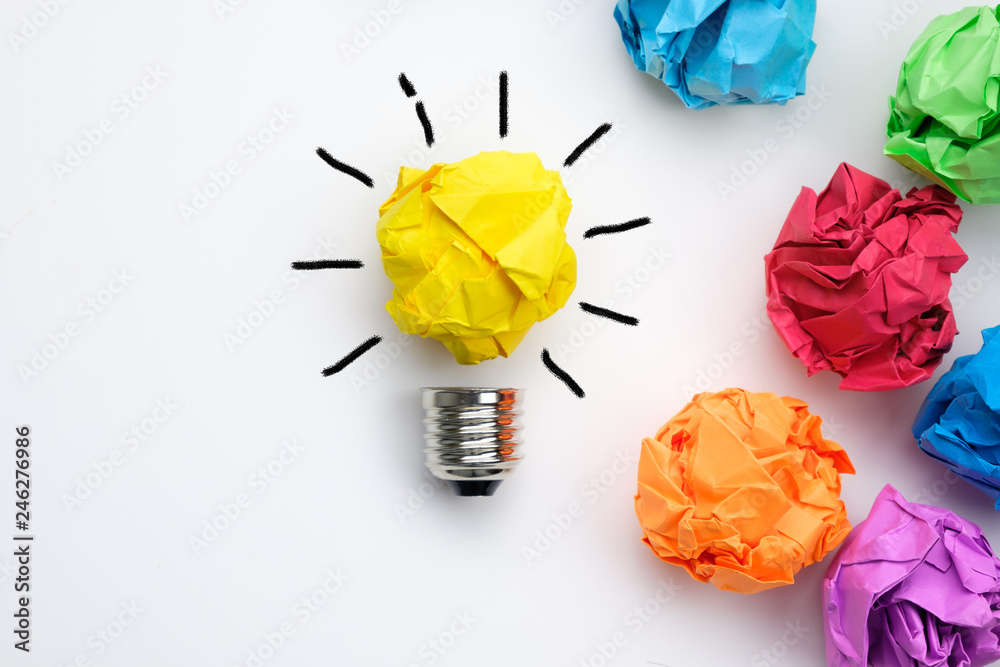 Great idea concept with crumpled colorful paper and light bulb on